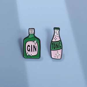 Cartoon gin and tonic enamel pins set in bottle shape with minimalist design