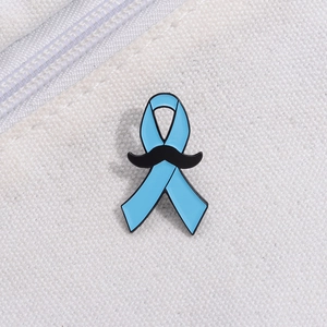 Blue ribbon enamel brooch with black mustache pattern on white fabric texture