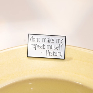 Rectangle enamel pin with History don't make me repeat myself quote in black and white
