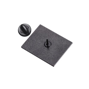 Detail of matte black square brooch back with butterfly clutch pin fastening