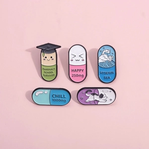Set of five enamel medical capsule pins with funny pharmacy school survivor designs