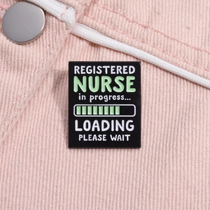 Macro detail of black enamel Registered Nurse in progress loading bar pin brooch