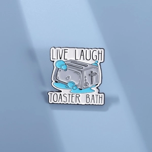 Live Laugh Toaster Bath enamel pin featuring a grey toaster and blue bubbles on blue backdrop