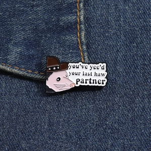 Enamel opossum pin with cowboy hat on denim background featuring funny quote
