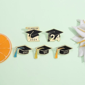5-piece set of Graduation 2024 enamel pins with black academic caps and golden accents