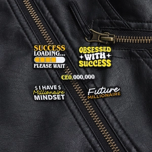 Close-up of inspirational metal enamel pins pinned on a black leather jacket