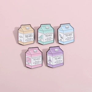 Five colorful milk carton enamel pins with student tears academic humor design