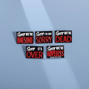 Set of 5 minimalist black enamel pins with humorous text on light blue background