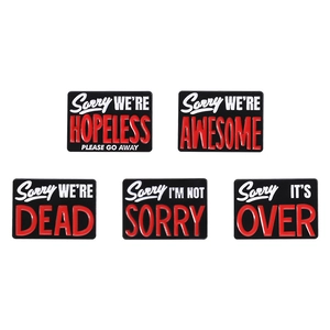 Set of 5 rectangular enamel pins with black background and bold white and red text