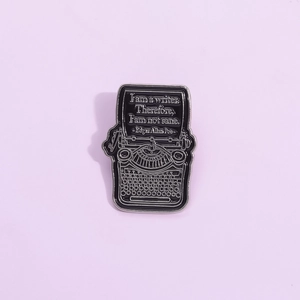 Cute cartoon typewriter enamel pin badge with classic retro metal design and literary quote