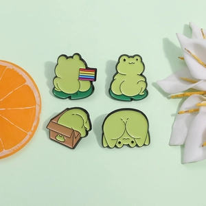 Set of four cute green frog enamel pins with rainbow flag and lily background