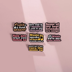 Set of 7 music-themed enamel pins with pop style quotes on pink background