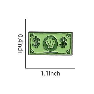 Détail du pin's émaillé vert en forme de billet avec motif coquillage et signe dollar, 1.1x0.4 p