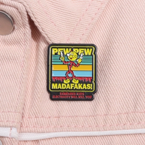Detail of red cartoon character enamel pin with dual guns on pink denim fabric