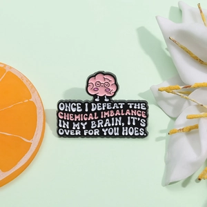 Cartoon brain enamel pin with quote on a creative background with flowers and orange