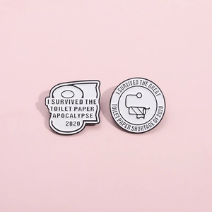 Detail view of survival toilet paper humor enamel pins with black and white finish