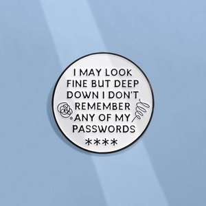 Round white enamel pin with humorous text I May Look Fine But I Don't Remember Passwords