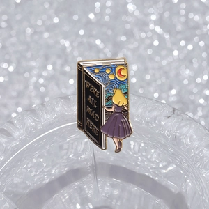 Detailed enamel pin with Starry Night art and We Are All Mad Here quote engraving