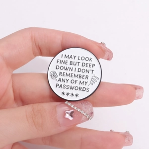 Round white enamel pin with humorous I don't know my password text on person's hand