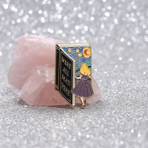 Fantasy enamel pin book design with Alice entering starry night and iconic quote