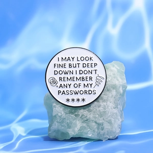 White round enamel lapel pin with funny password quote on green crystal and blue water wave