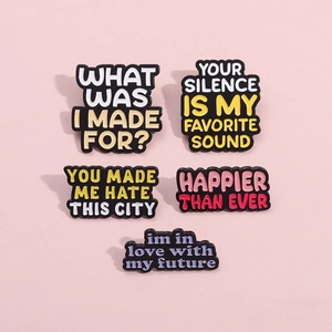 Set of 5 colorful enamel brooch pins with inspirational quotes on pink background