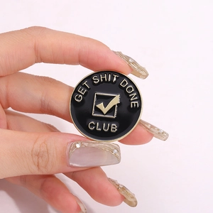 Get Shit Done Club enamel pin badge in black and gold finish with tick symbol