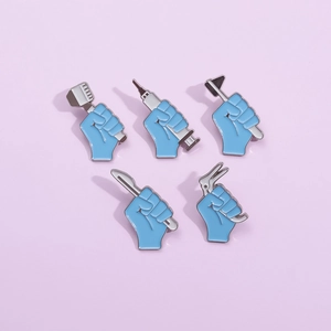 5-piece medical enamel pin set with syringe and scalpel shapes on purple background