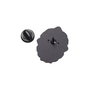 Detail view of black enamel pin back with matte texture and durable rubber clutch