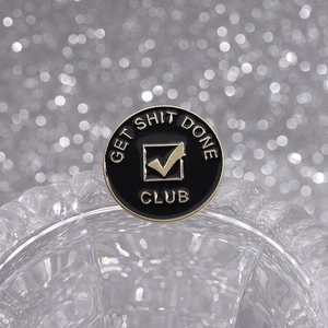 Golden Get Shit Done Club enamel pin badge with black background for minimalist style