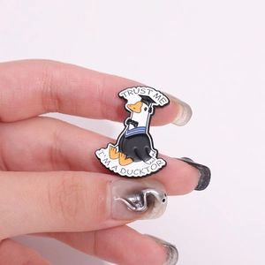 Funny Doctor Duck enamel pin with Trust Me I'm a Ducktor text and cartoon animal design