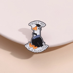 Cute duck doctor enamel pin with Trust Me I'm a Ducktor text for clothing decor
