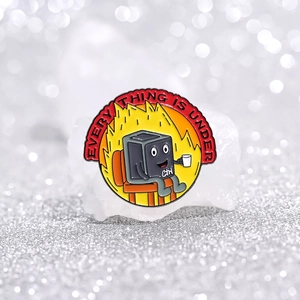 Detail of creative Ctrl enamel pin with everything is under control pun design