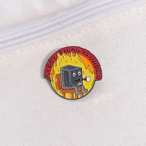 Cartoon enamel pin featuring a Ctrl key sitting by a fire with text Everything Is Under Control