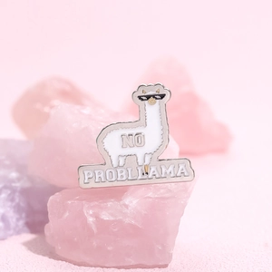 Cute white alpaca enamel pin with sunglasses and No Probllama text on pink stone