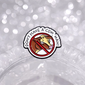 Cow graphic enamel pin with Don't Have A Cow, Man! text in red prohibition sign