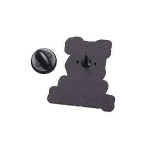 Close-up of the textured black alloy pin back and rubber clutch for a secure fit
