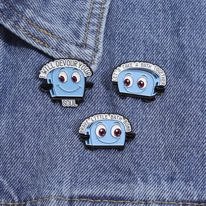 Funny blue toaster enamel pin set with witty text on denim fabric for jacket accessories