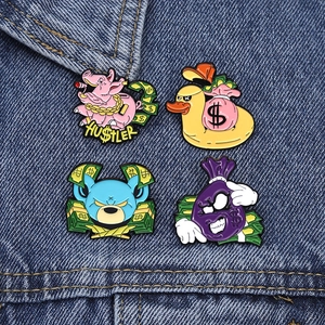 Cartoon street style enamel pins featuring pig, duck, bear and money bag on denim fabric