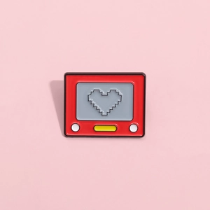 Cute retro red drawing tablet enamel pin with pixel heart design on pink background