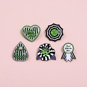 5-piece Beetlejuice inspired enamel pin set with green and black gothic stripe designs
