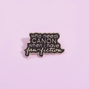 Enamel pin badge featuring who needs CANON when i have fan-fiction text on purple background