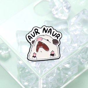 Cute opossum enamel pin badge with Aur Naur text meme in a creative icy display
