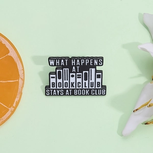 Enamel book club metal pin badge with black and white book shelf design and clever typography