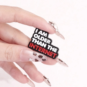 Retro black enamel brooch with I AM OLDER THAN THE INTERNET slogan for clothing and bags