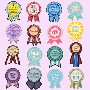 Macro display of sixteen colorful metal enamel brooches with humorous award medal designs