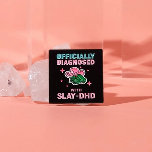 Green frog in pink cowboy hat enamel pin with officially diagnosed with slay-dhd text