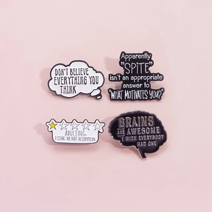 Minimalist black and white enamel pins with brain and ironic quotes on pink background