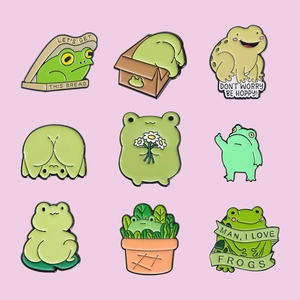 Set of 9 cute frog enamel pins with fun text like Let's Get This Bread in detail
