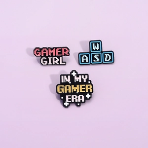 3-piece set of pixel art gamer enamel pins with Gamer Girl and WASD keyboard designs